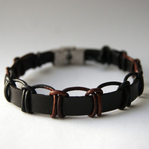 Bransoleta rzemień  brązowy oplatany dł. 25 cm