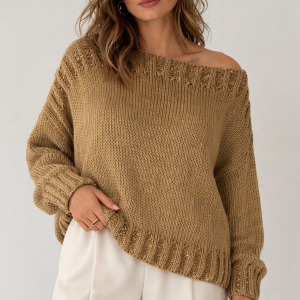 Złoty pulower wykonany z bawełny i lnu, z błyszczącymi cekinami